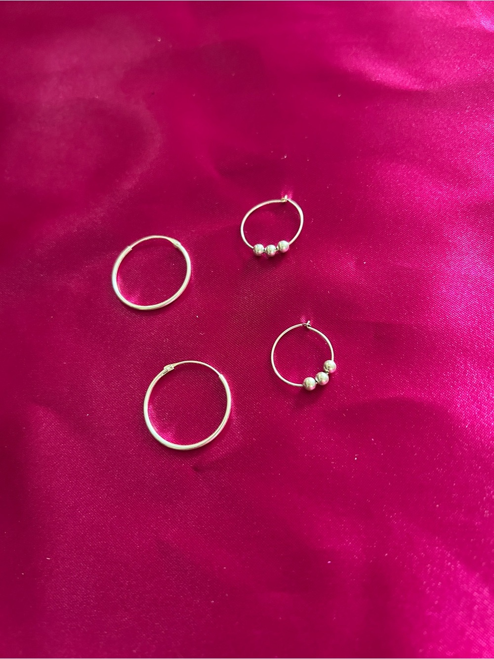 2 Sets of Silver Sleeper Hoop Earring Sets.